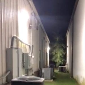 Photo of traditional LED Wall Pack in service alley