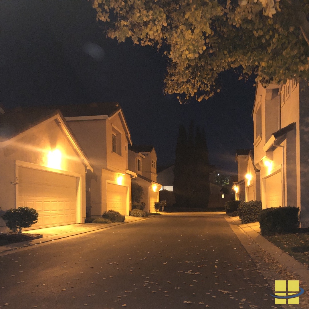 Before: Uneven illumination with significant dark spots caused by outdated HPS fixtures