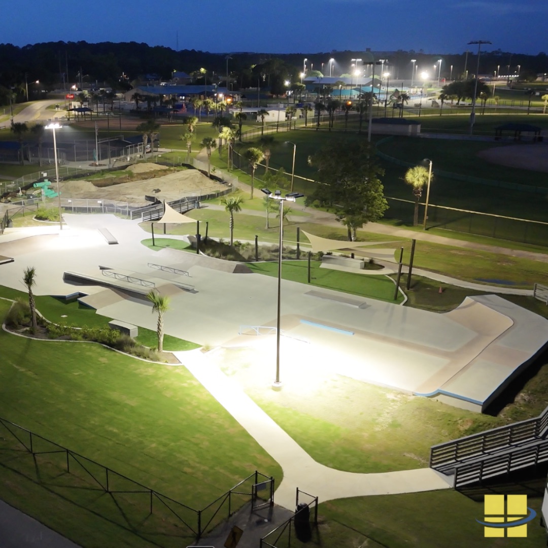 Completed LED lighting installation at Frank Brown Skate Park in Panama City Beach, FL — two 35-foot marine-grade poles with eight LED fixtures delivering 20+ footcandles